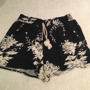 Black shorts with cream flowers